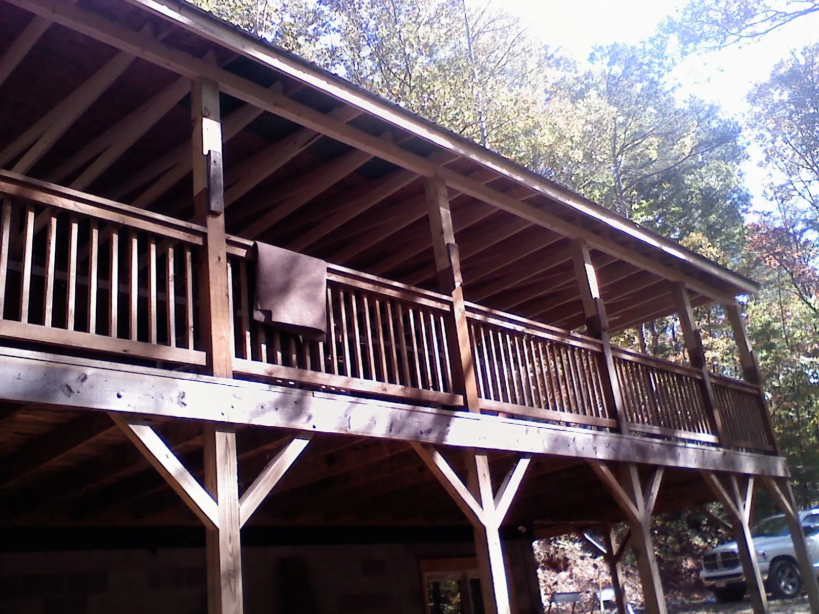 Timber framing under a new elevated porch and deck — Roof Leak Repair in North Woodstock by Roofing Brothers
